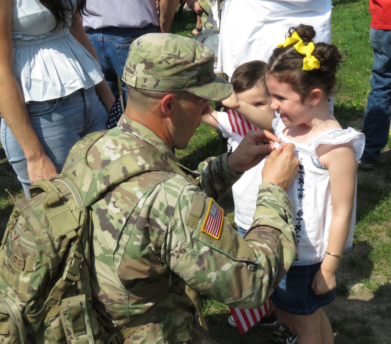 This little girl was quite happy to see her father return home. (Photo by David Yarger)